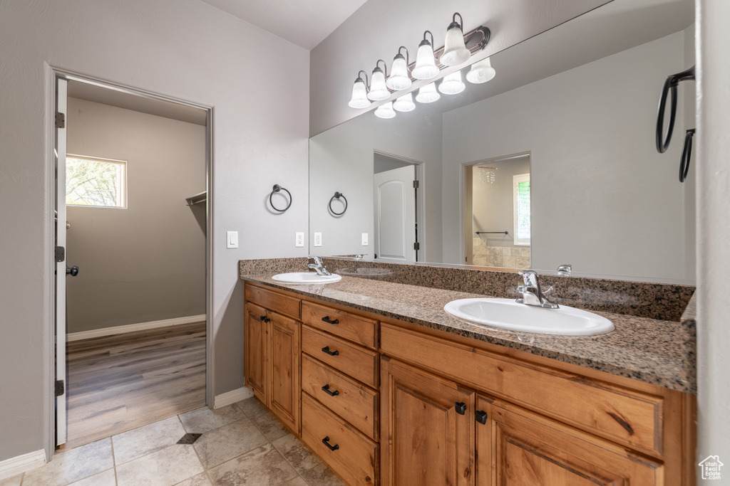 Bathroom with vanity and hardwood / wood-style floors