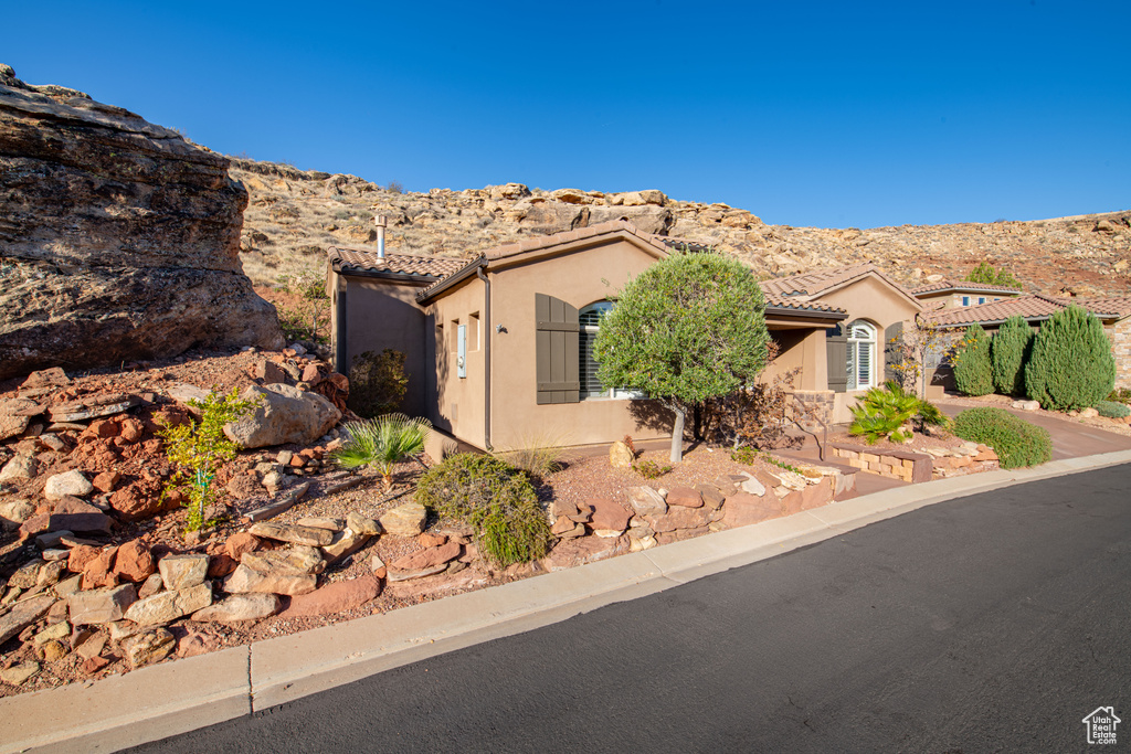 View of front of house featuring a mountain view