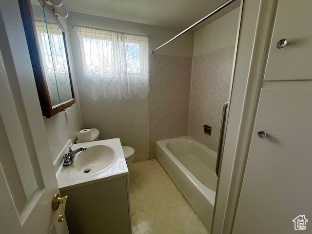 Full bathroom with vanity, toilet, and shower / bath combination