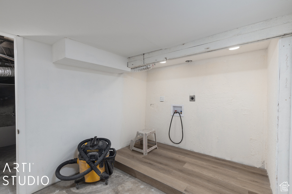 Basement featuring hardwood / wood-style flooring