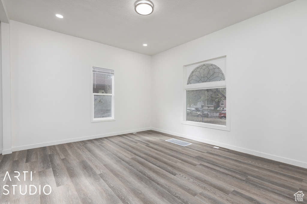 Empty room featuring hardwood / wood-style flooring