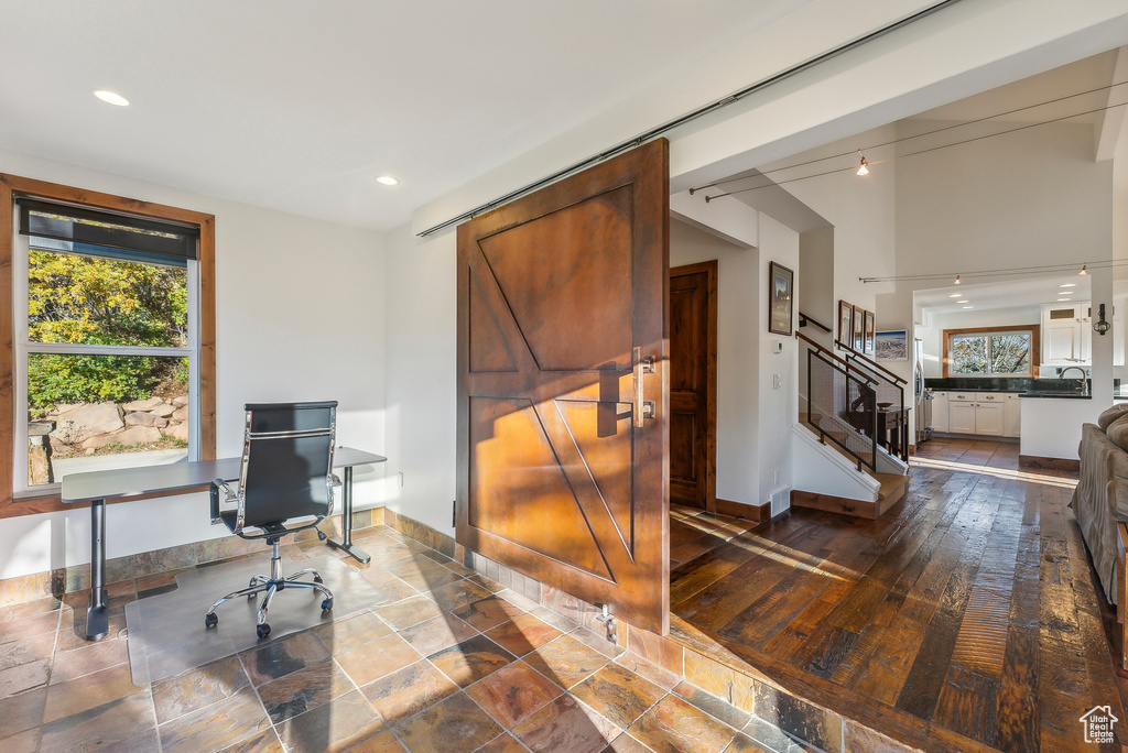 Office area featuring sink and dark hardwood / wood-style floors