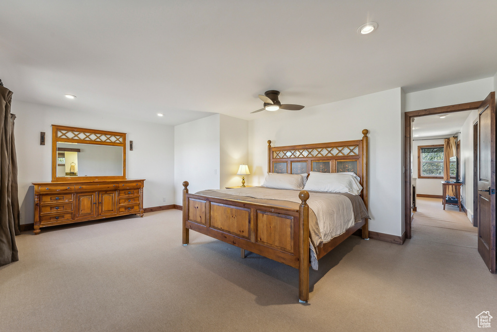 Bedroom featuring light carpet and ceiling fan