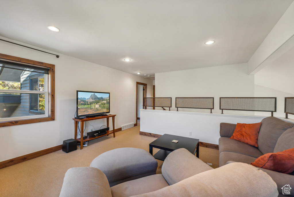 Living room featuring light carpet