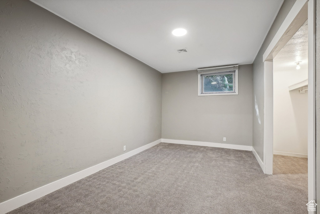 Unfurnished room with carpet floors