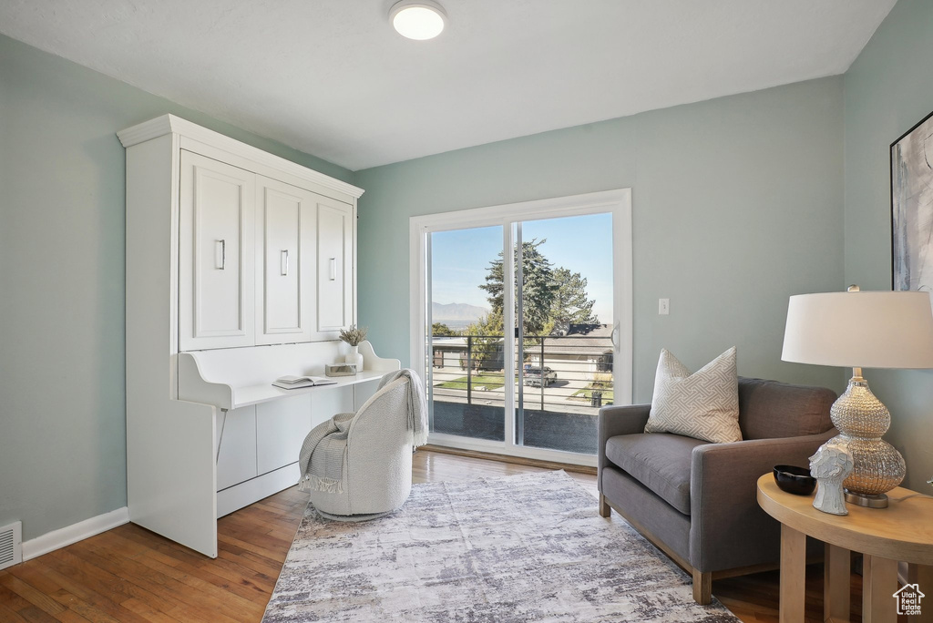 Office with hardwood / wood-style flooring