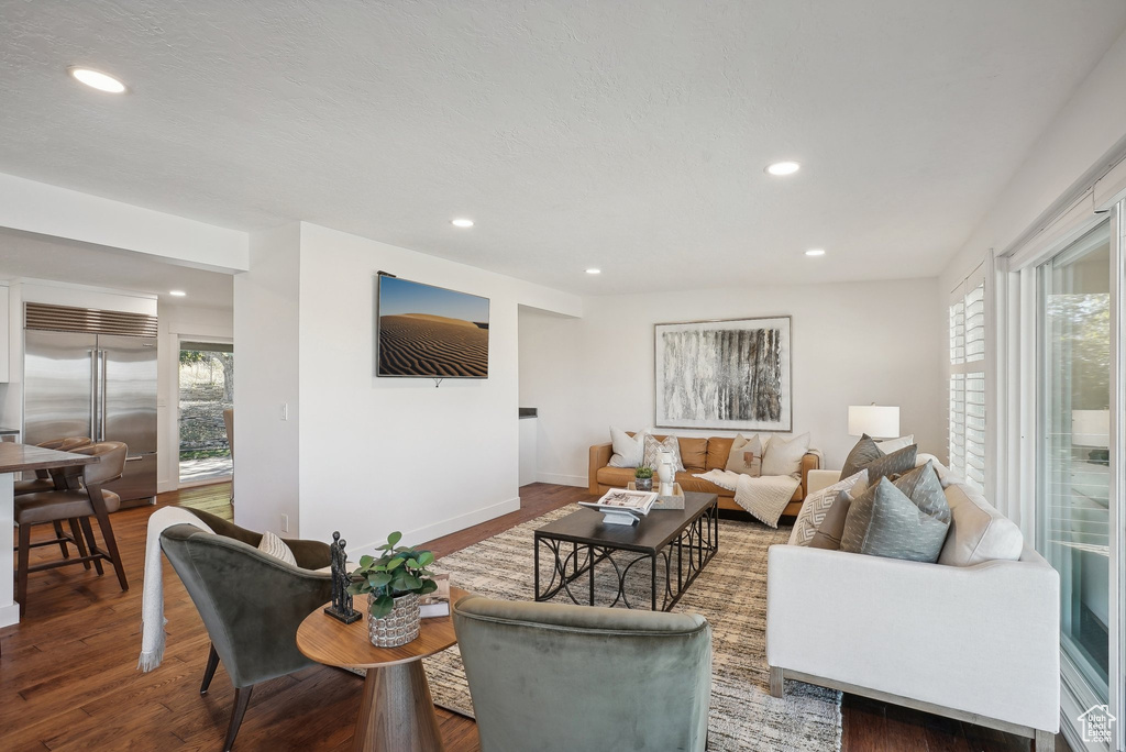 Living room with hardwood / wood-style flooring and plenty of natural light