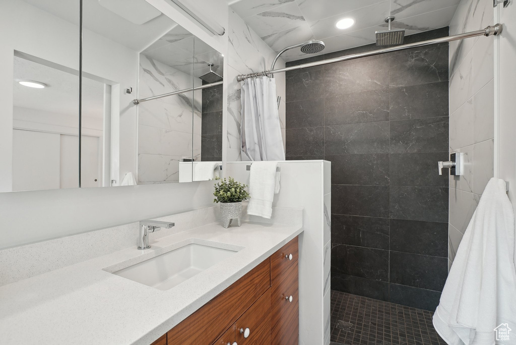 Bathroom featuring vanity and a shower with curtain