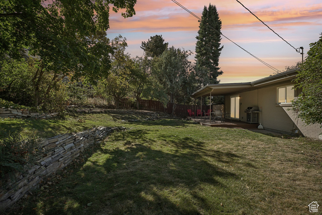 Yard at dusk with a patio