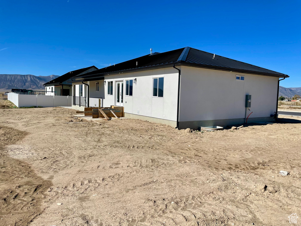 Rear view of property featuring a mountain view