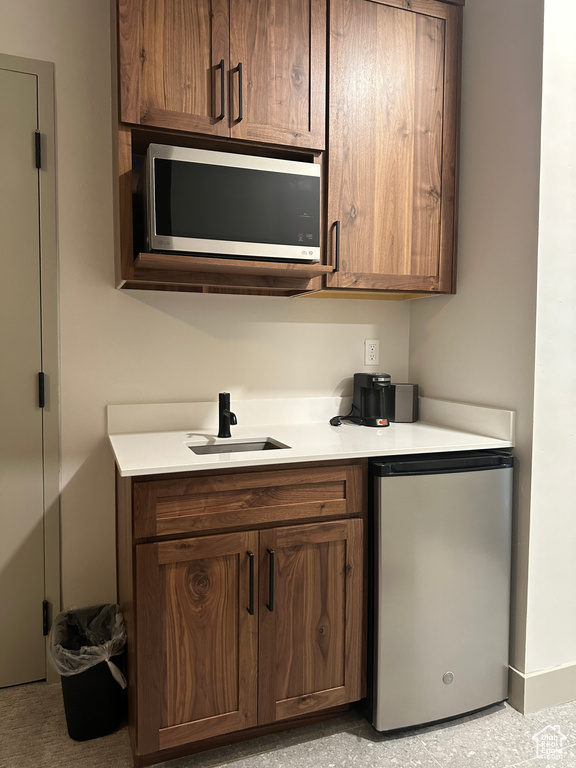 Kitchen with stainless steel appliances and sink