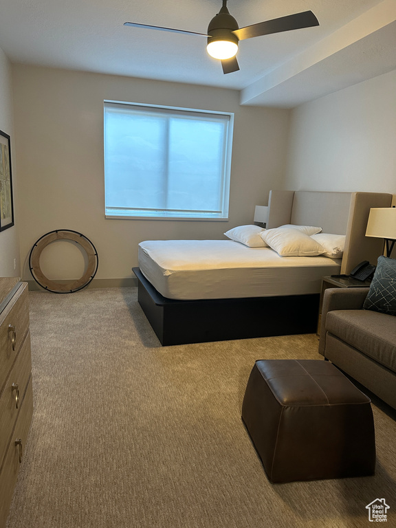 Bedroom featuring light carpet and ceiling fan