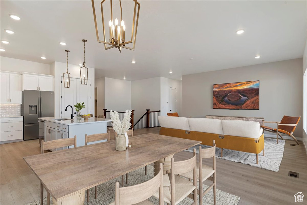 Dining area featuring light hardwood / wood-style floors and sink