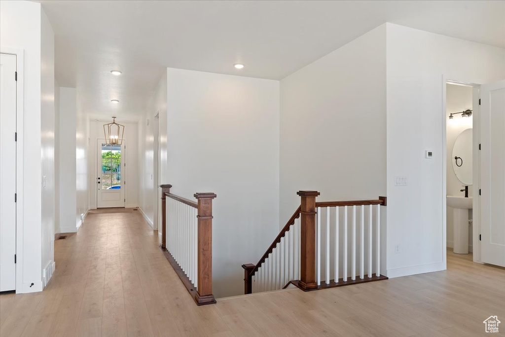 Corridor featuring light wood-type flooring