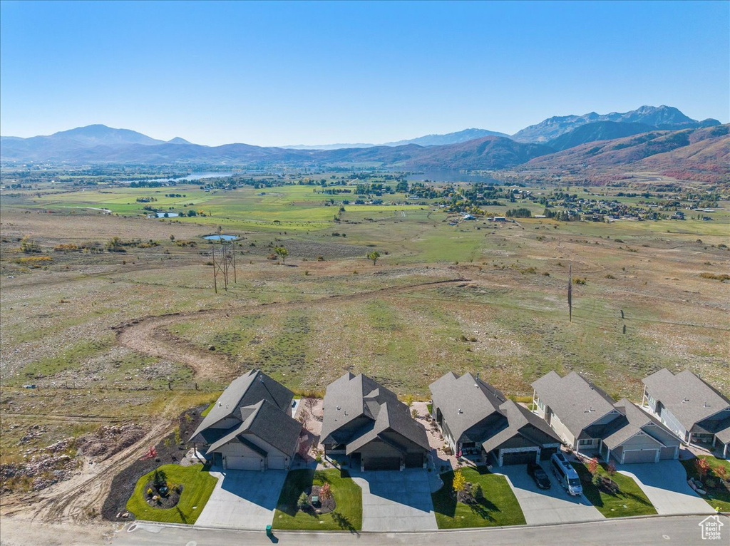 Birds eye view of property with a mountain view and a rural view