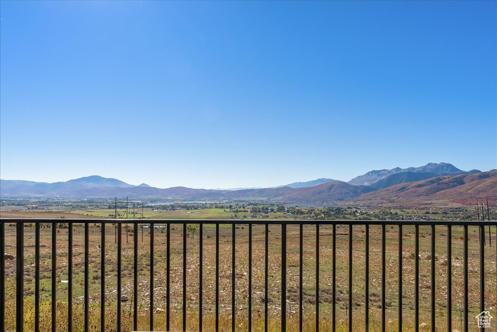 Property view of mountains with a rural view