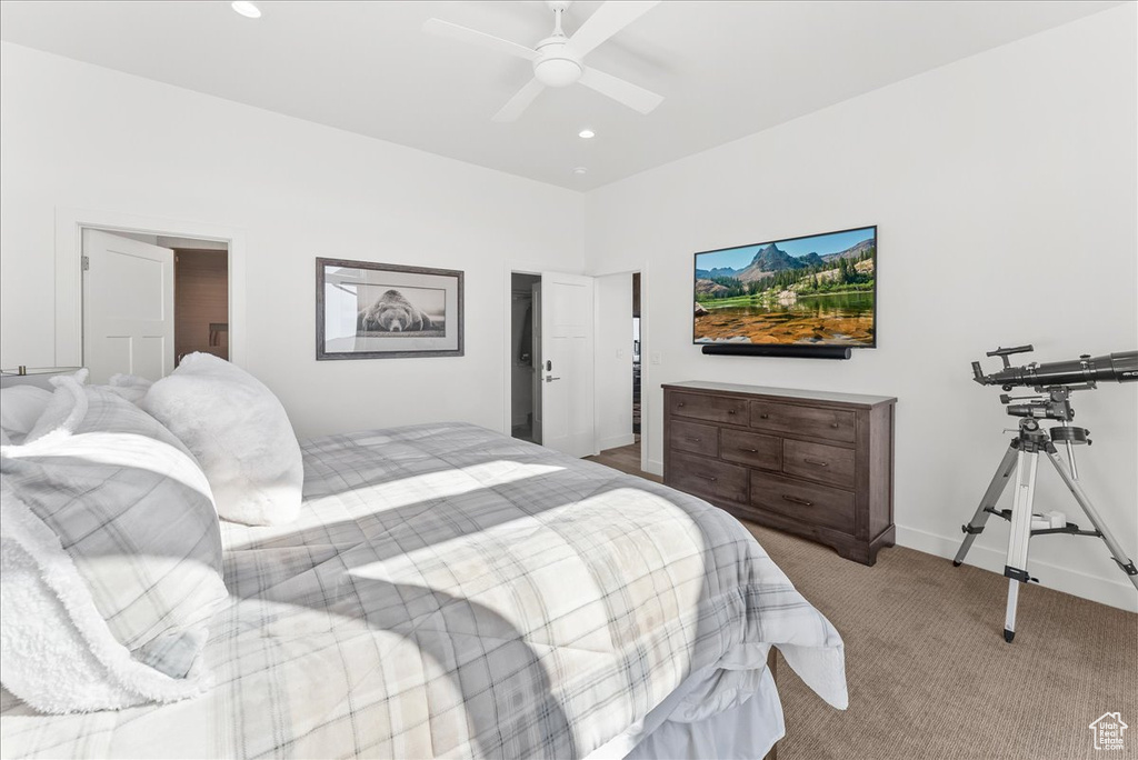 Bedroom with ceiling fan and carpet floors