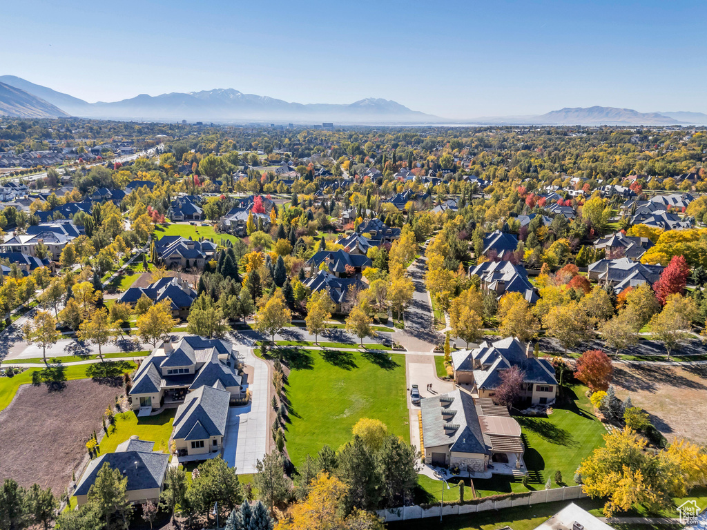 Birds eye view of property with a mountain view