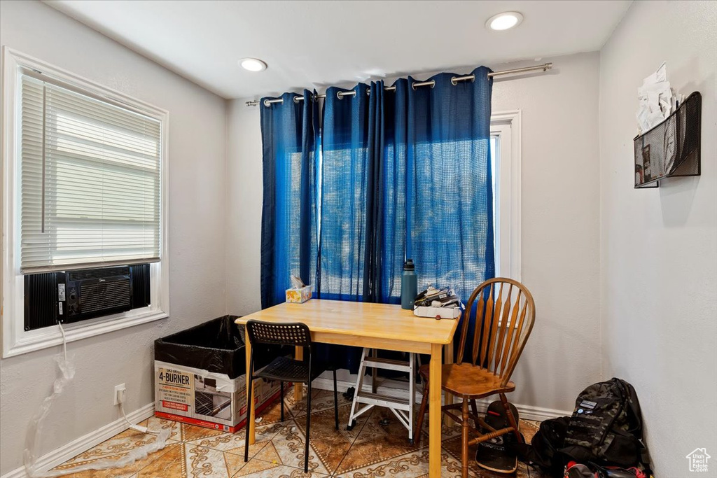 Office space featuring tile patterned floors and cooling unit