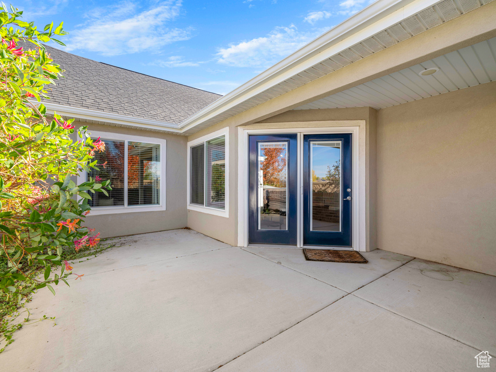 Property entrance featuring a patio area