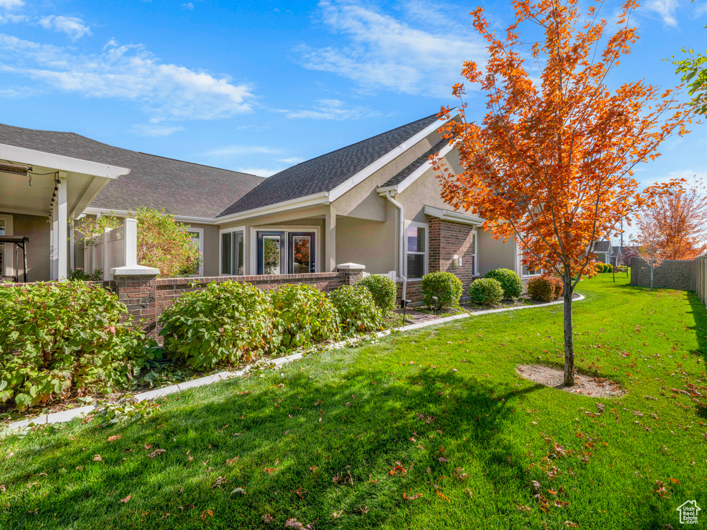 Exterior space featuring a yard