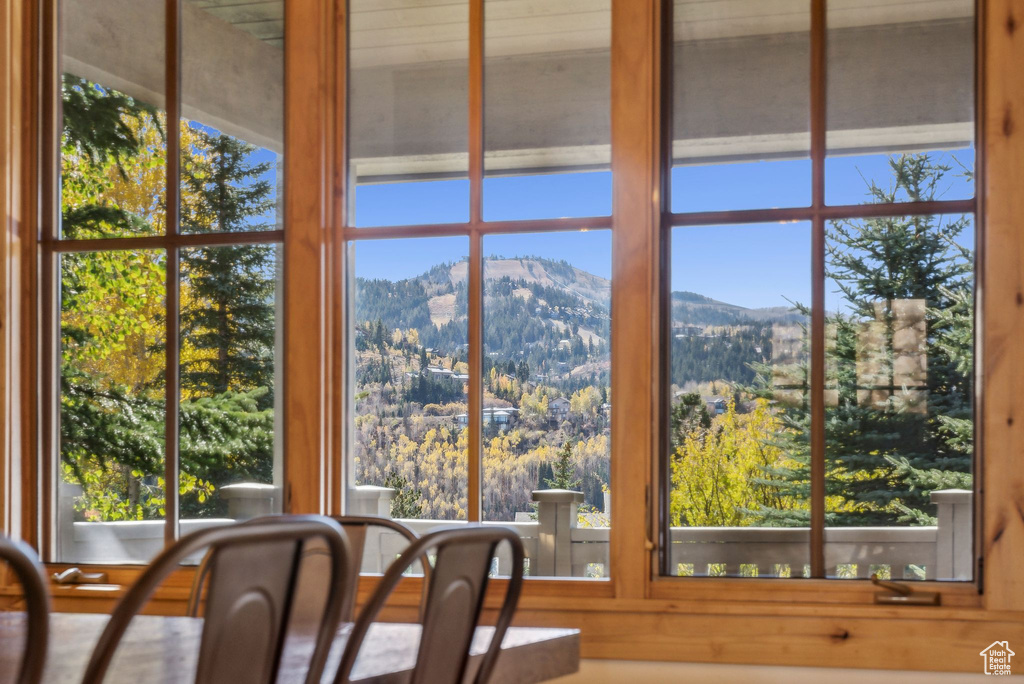 Sunroom / solarium with a mountain view