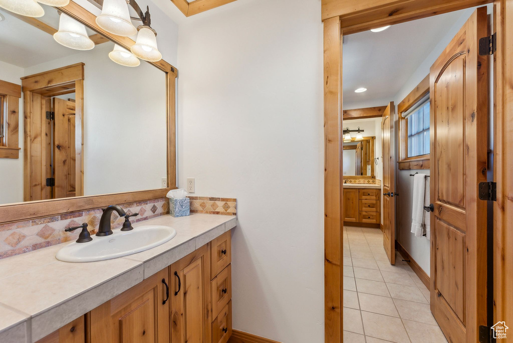 Bathroom featuring vanity and tile patterned flooring