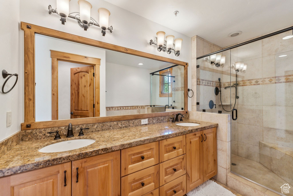 Bathroom with vanity and an enclosed shower