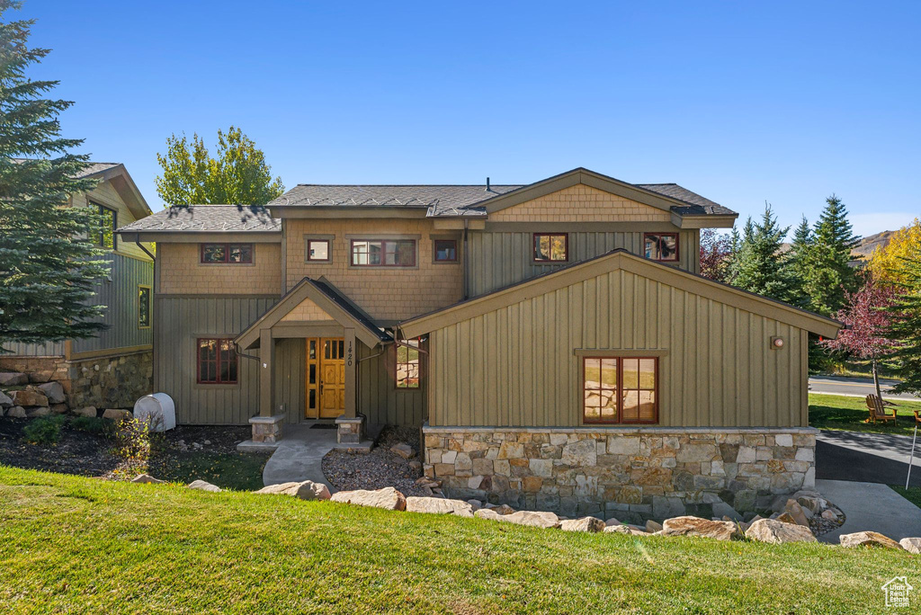 View of front of property with a front yard