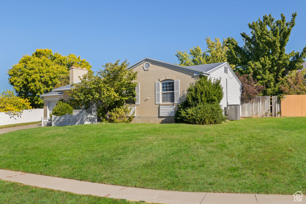 View of front of property with a front lawn