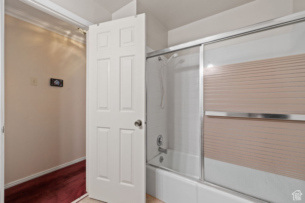 Bathroom with enclosed tub / shower combo