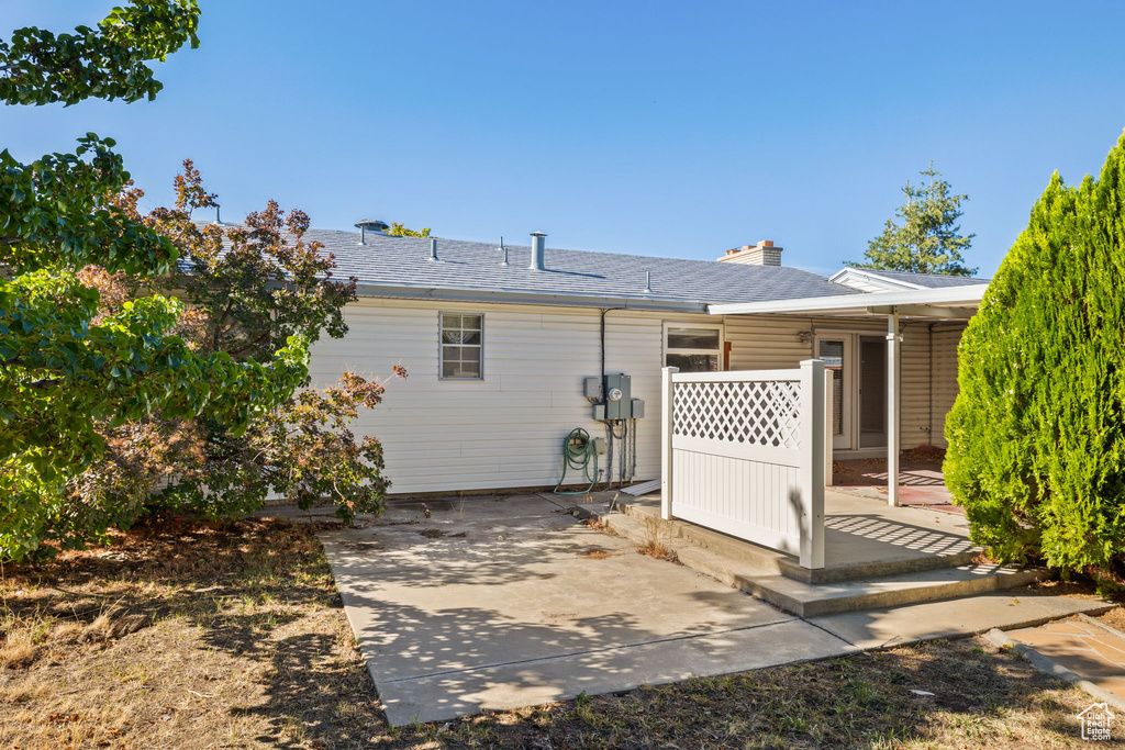 Back of house with a patio area