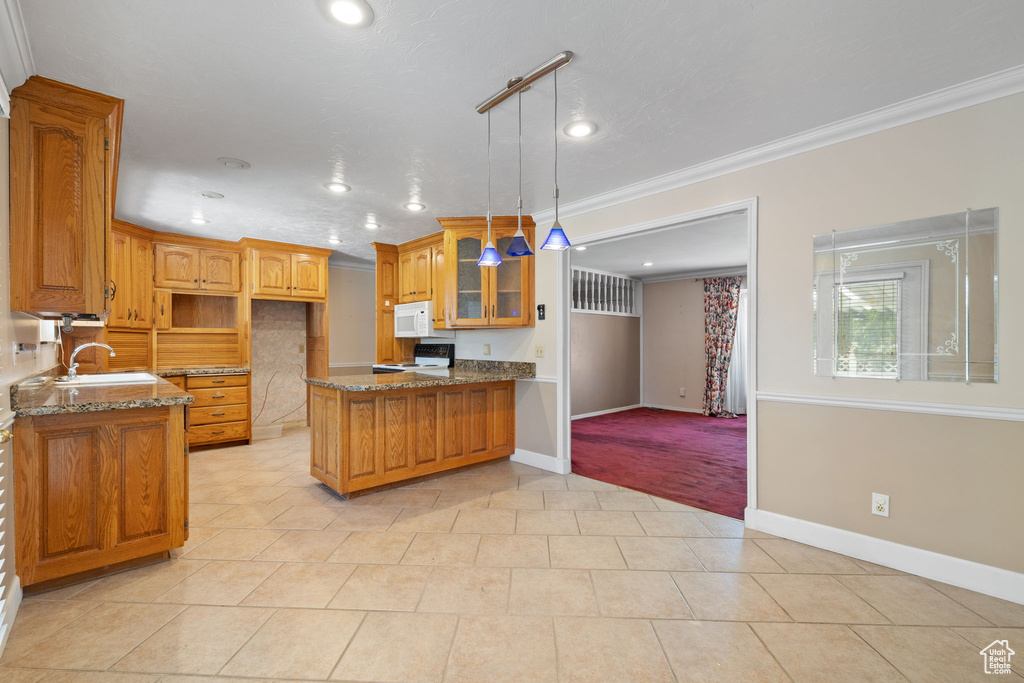 Kitchen featuring ornamental molding, stone countertops, pendant lighting, and white appliances