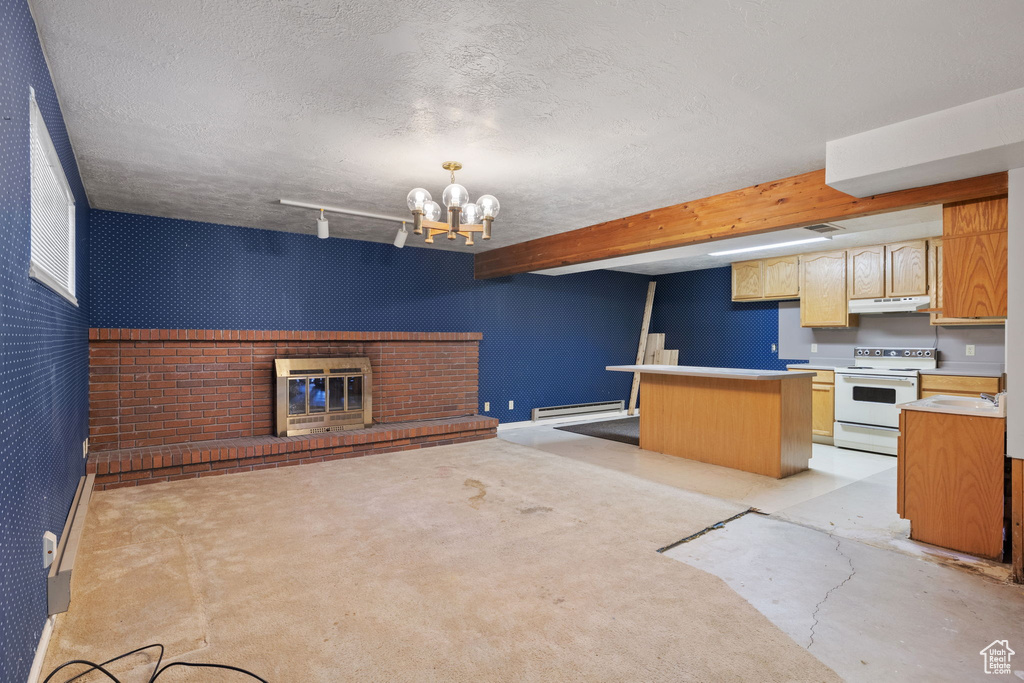 Kitchen featuring beam ceiling, a baseboard heating unit, white range with electric stovetop, a center island, and an inviting chandelier