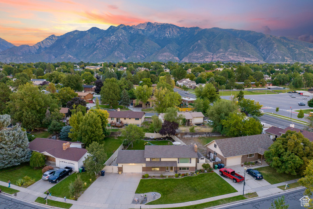 Aerial view at dusk featuring a mountain view