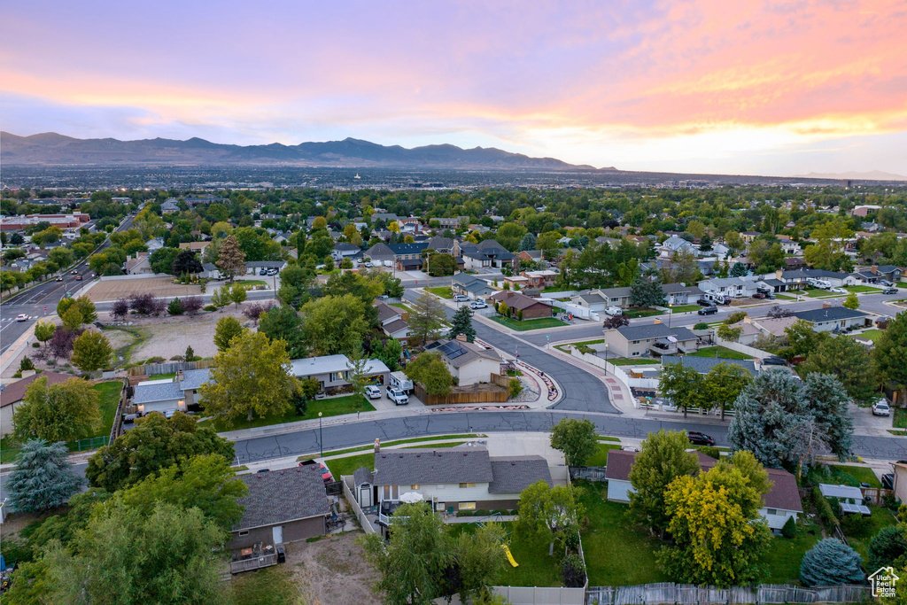 Aerial view at dusk featuring a mountain view