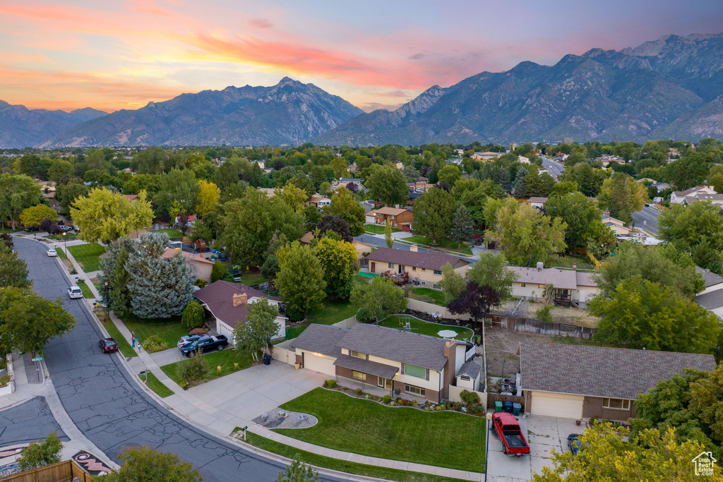 Aerial view at dusk featuring a mountain view