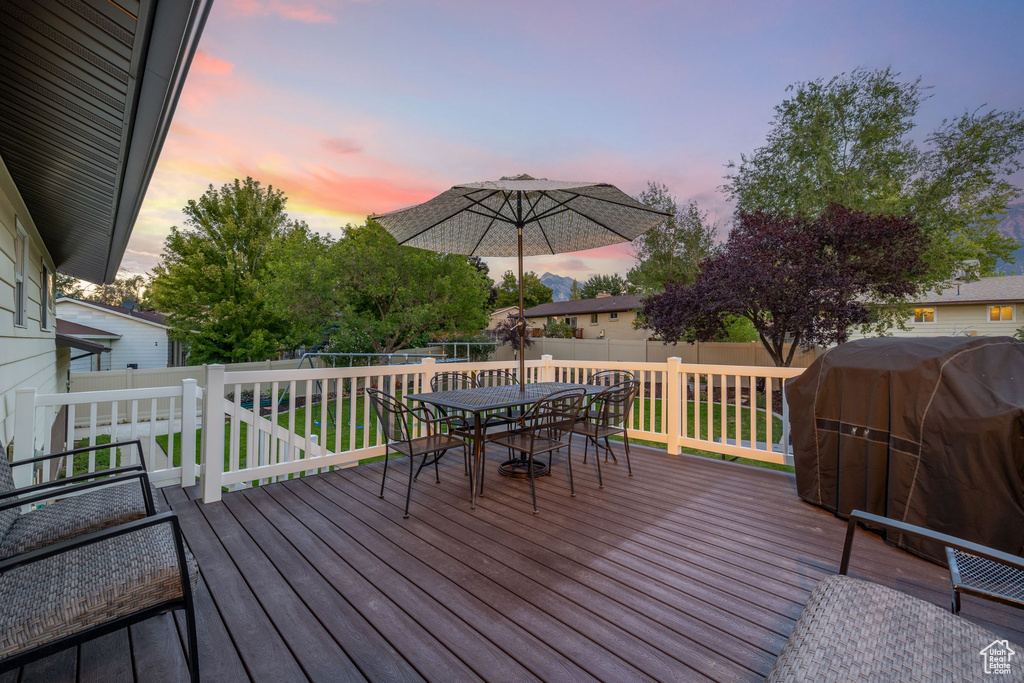 Deck at dusk with area for grilling