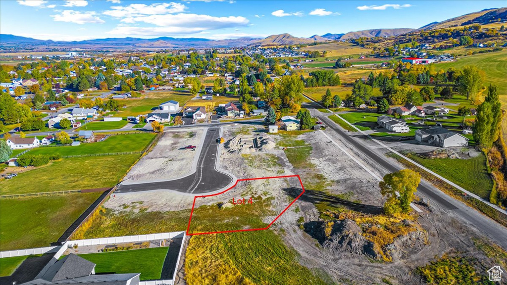 Birds eye view of property featuring a mountain view