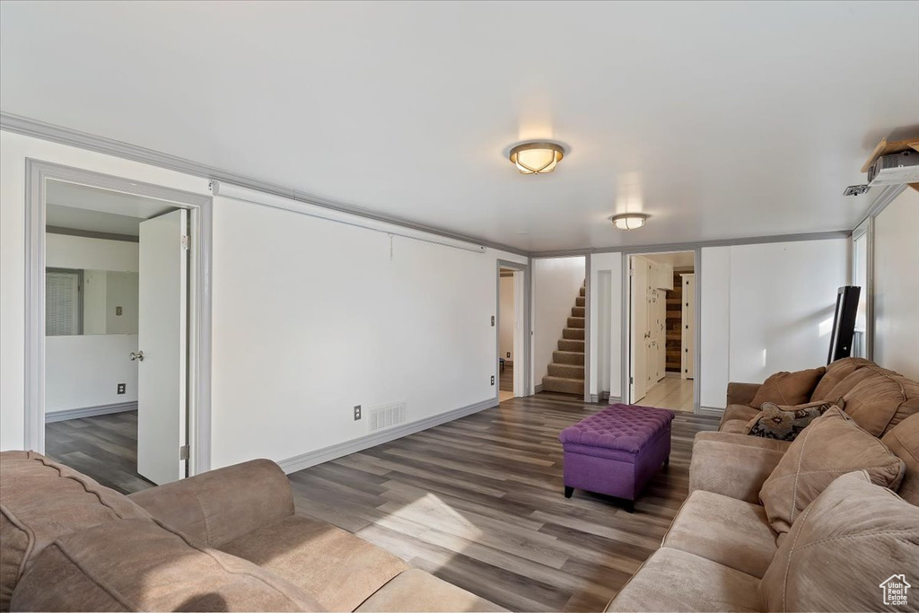 Living room with hardwood / wood-style flooring