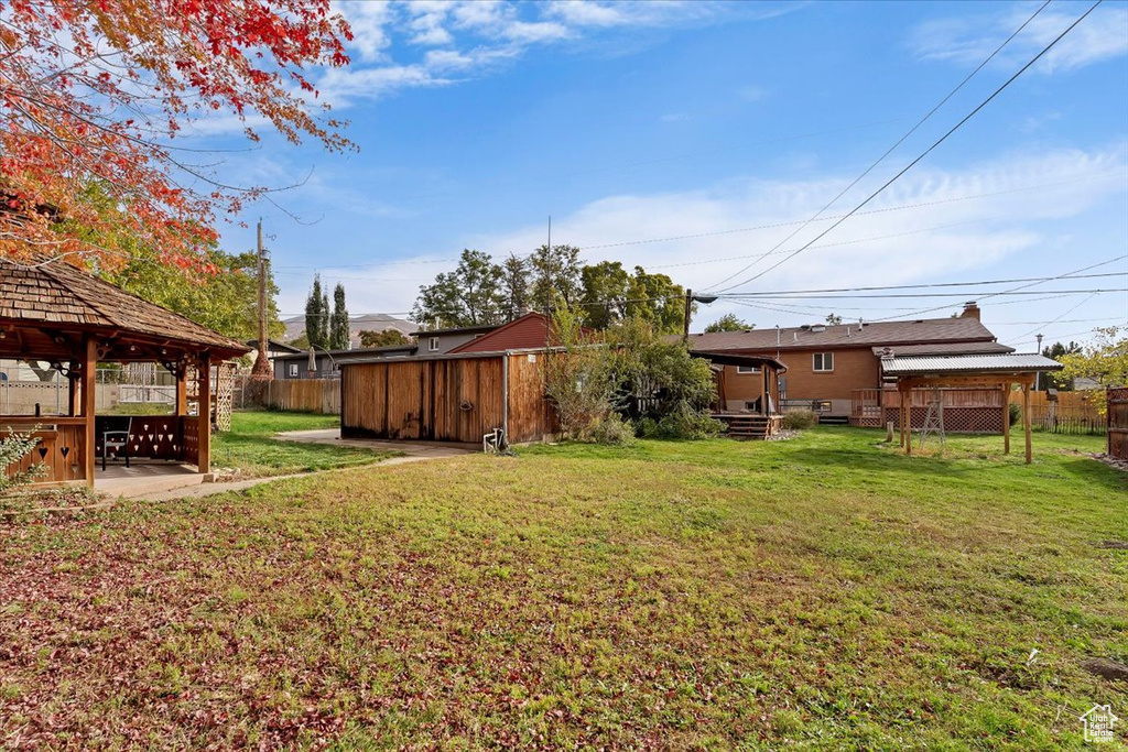 View of yard with a gazebo and a patio area