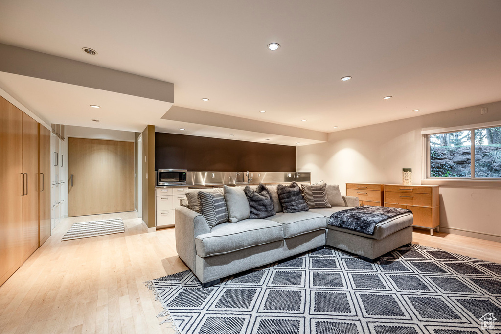 Living room with light hardwood / wood-style floors