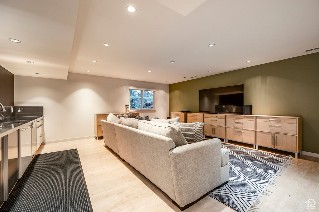 Living room with light hardwood / wood-style flooring