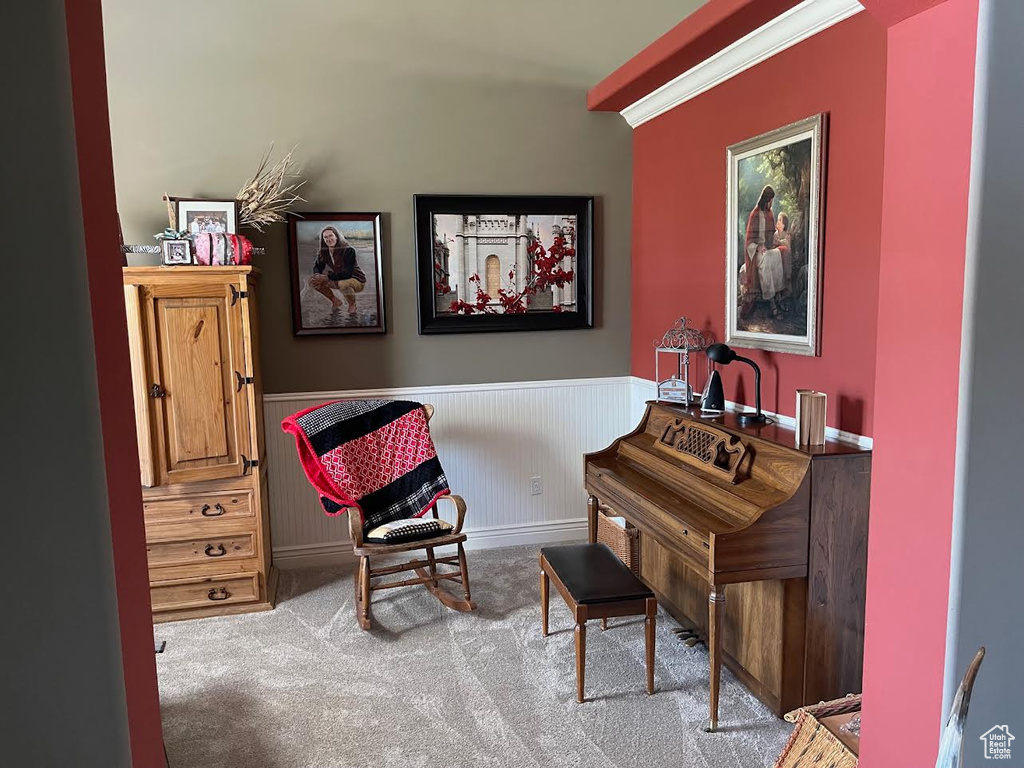 Sitting room featuring light carpet