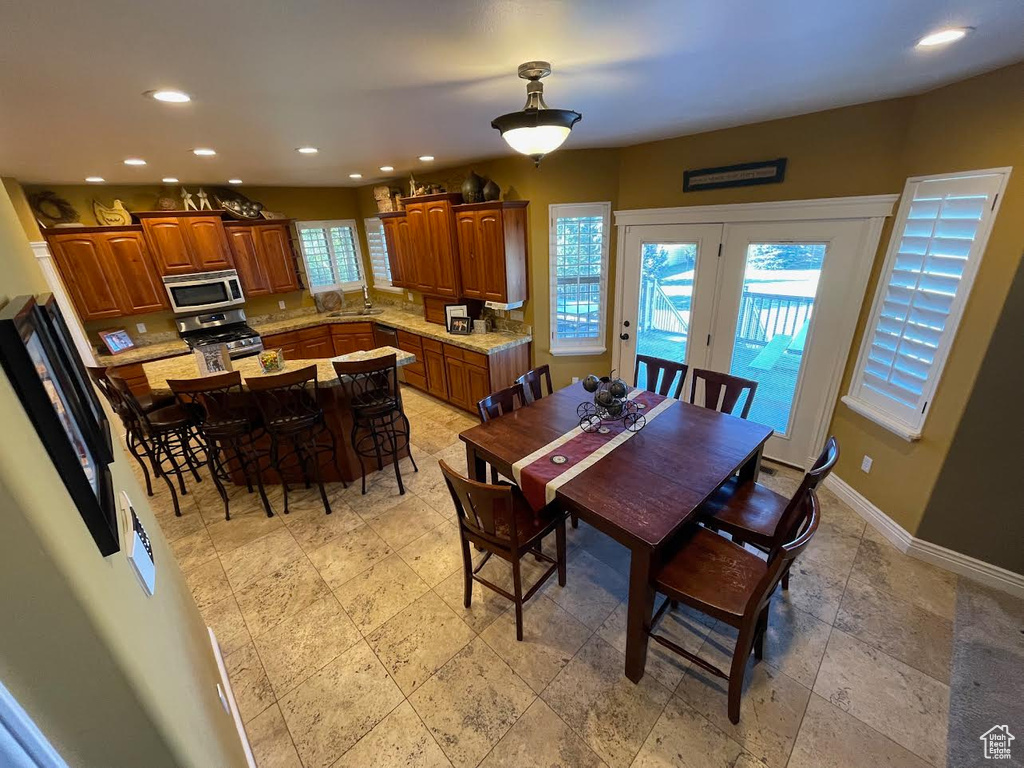 Dining area with sink and plenty of natural light