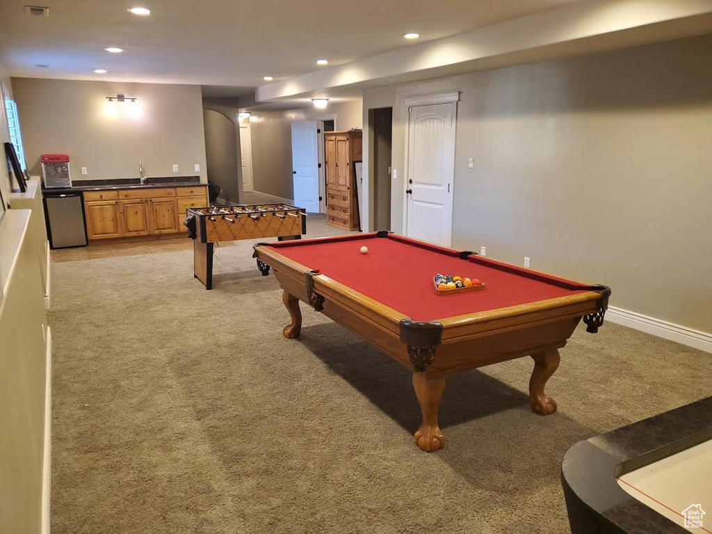 Rec room with indoor wet bar, light carpet, and billiards