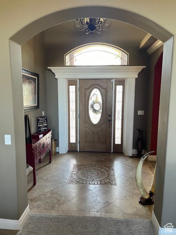 Foyer featuring an inviting chandelier