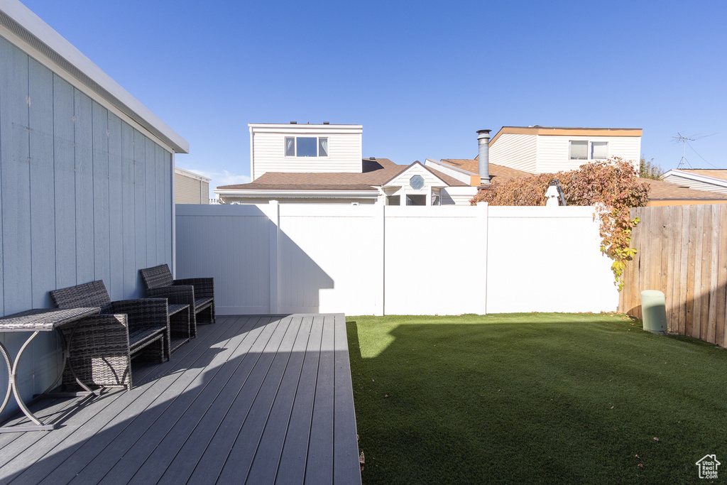 View of yard with a deck