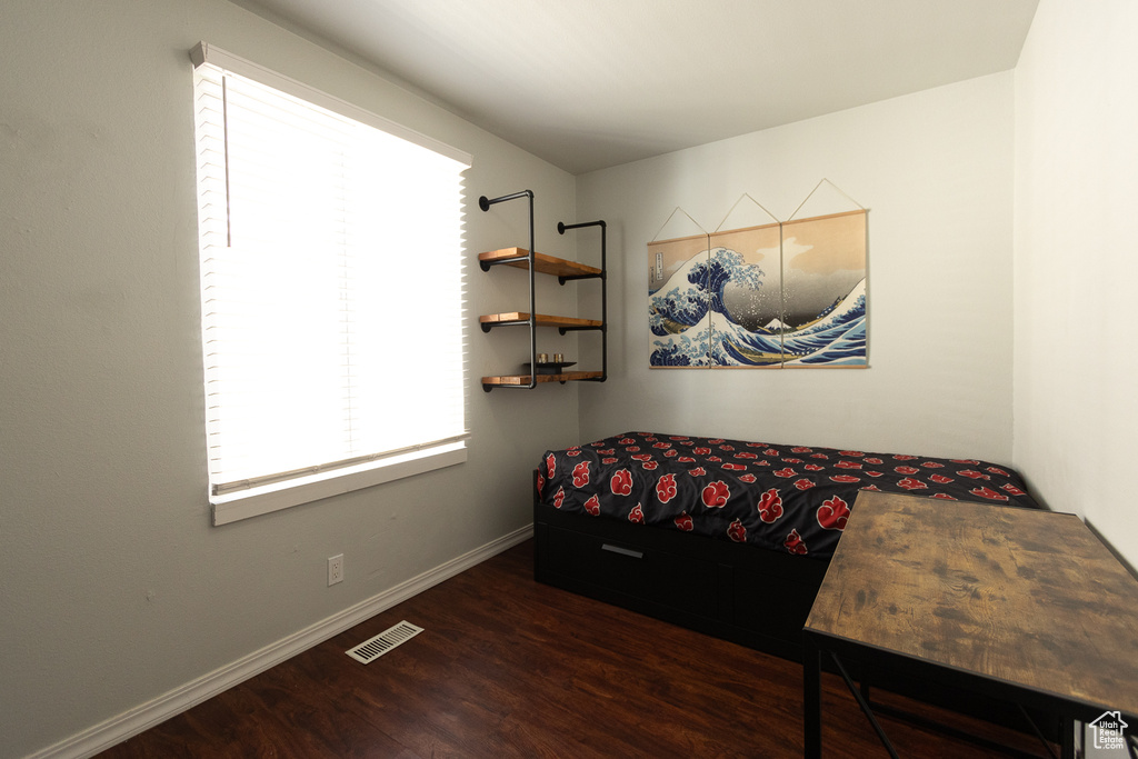 Bedroom featuring dark hardwood / wood-style flooring