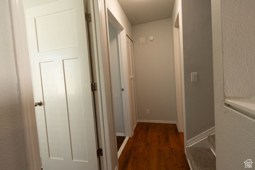 Corridor featuring dark hardwood / wood-style floors